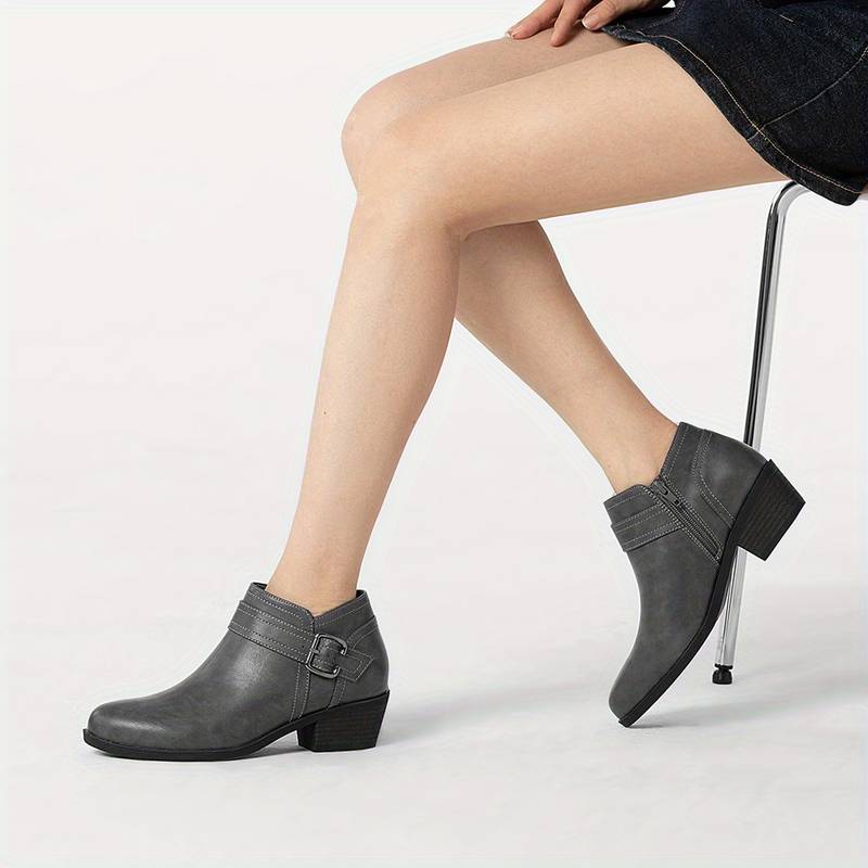 Women’s chunky low heel buckle ankle boots.