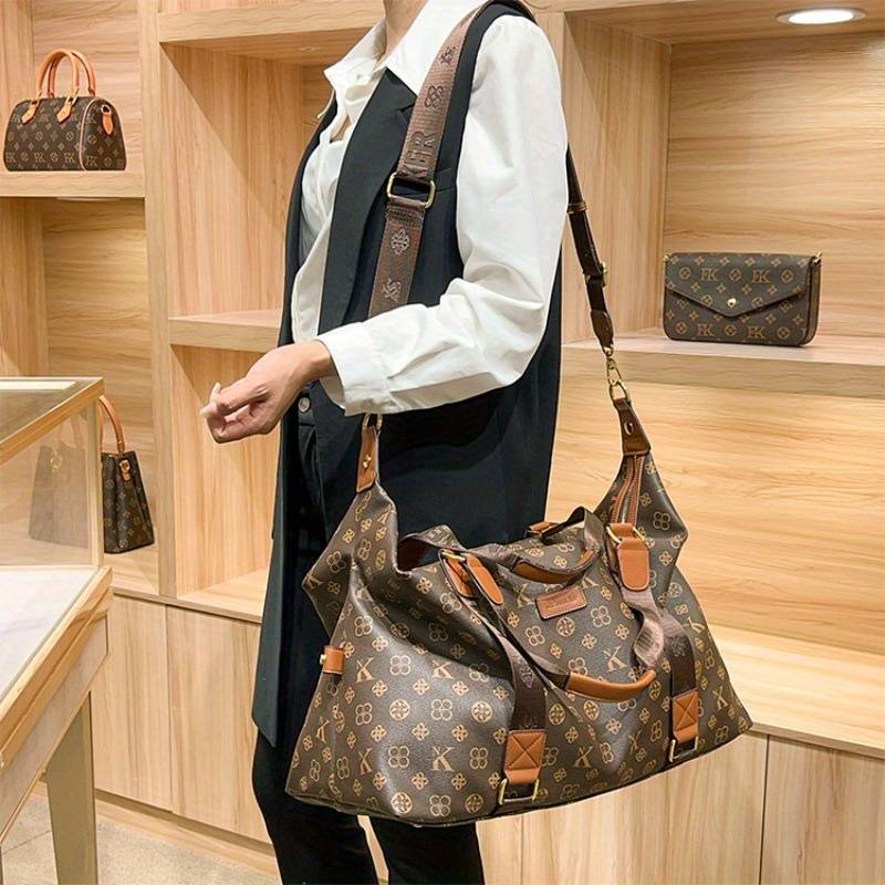 Retro cylindrical handheld and crossbody travel bag.
