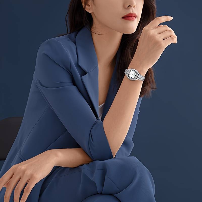 Luxury square quartz watch with steel strap.