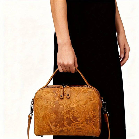Women’s leather floral embossed tote and crossbody bag.