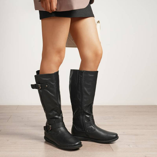 Women’s wide calf fur-lined knee-high winter boots.